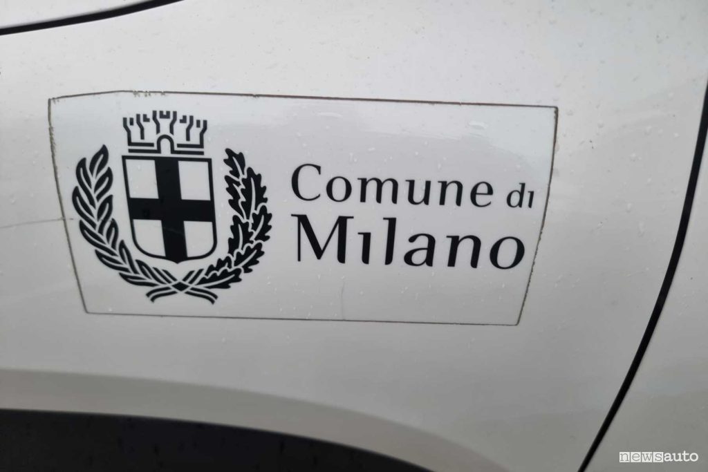 Dacia Spring car-sharing Zity logo Comune di Milano